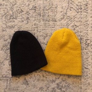 Black and yellow beanies. Both in worn condition.